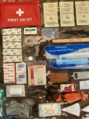 131 Piece Emergency Outdoor Survival Kit with drawstring camo bag