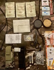 135 Piece Emergency Outdoor Survival Kit with drawstring camo bag