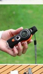 MULTI-FUNCTION 7-IN-1 WHISTLE/COMPASS/THERMOMETER/LIGHT/MAGNIFIER/MIRROR/STORAGE