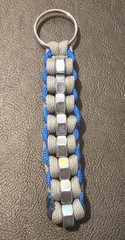 Gray and Blue Keychain with 8 Silver Bolts