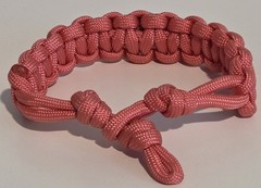 Maroon Tomorrowland on Pink Paracord Bracelet – 9.75″ Long w/Loop Knot Closure