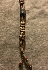 Keychain or knife lanyard. Bag, backpack, jacket zipper pull. Sad-smiley face