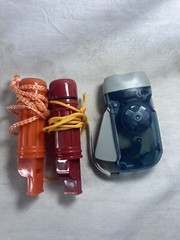 Two Survival Compass, Whistle + Match Holder And Wind Up Survival Flashlight