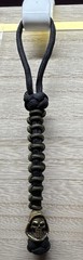 Handmade Black/Green 6 in 550 lb paracord lanyard w/ metal grim reaper bead.