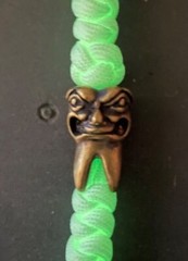 Glow-in-the-dark knife lanyard. Bag, backpack or jacket zipper pull. Angry tooth