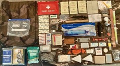 131 Piece Emergency Outdoor Survival Kit with drawstring camo bag