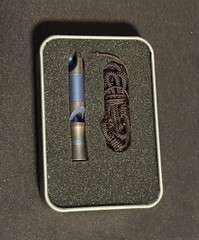 We Knife Co Lt Whistle Anodized Titanium Construction w/Brown Paracord Lanyard