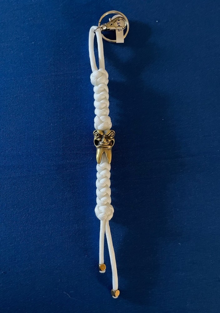 Glow-in-the-dark knife lanyard. Bag, backpack or jacket zipper pull. Angry tooth