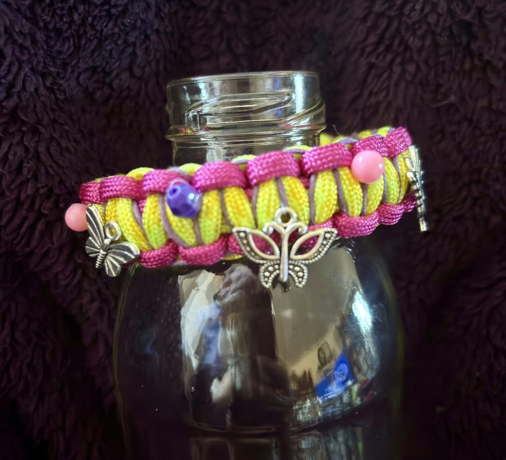 Butterfly Charm Paracord Bracelet. Measures 9 Inches With Buckle.