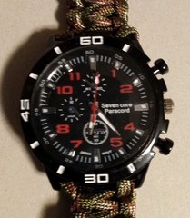 A Survival Watch with Paracord Wrist Band, Saw Blade, Whistle And Compass!
