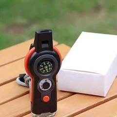 MULTI-FUNCTION 7-IN-1 WHISTLE/COMPASS/THERMOMETER/LIGHT/MAGNIFIER/MIRROR/STORAGE