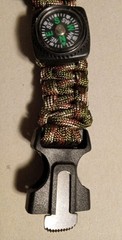 A Survival Watch with Paracord Wrist Band, Saw Blade, Whistle And Compass!