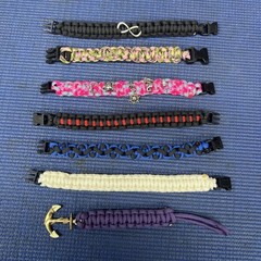 FB2- Lot of 7 Some Cobra Weaved Paracord Bracelets 7-1/2-8” End To End Charms