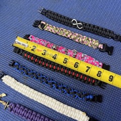 FB2- Lot of 7 Some Cobra Weaved Paracord Bracelets 7-1/2-8” End To End Charms