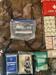 131 Piece Emergency Outdoor Survival Kit with drawstring camo bag