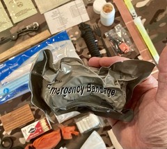 131 Piece Emergency Outdoor Survival Kit with drawstring camo bag
