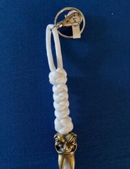 Glow-in-the-dark knife lanyard. Bag, backpack or jacket zipper pull. Angry tooth
